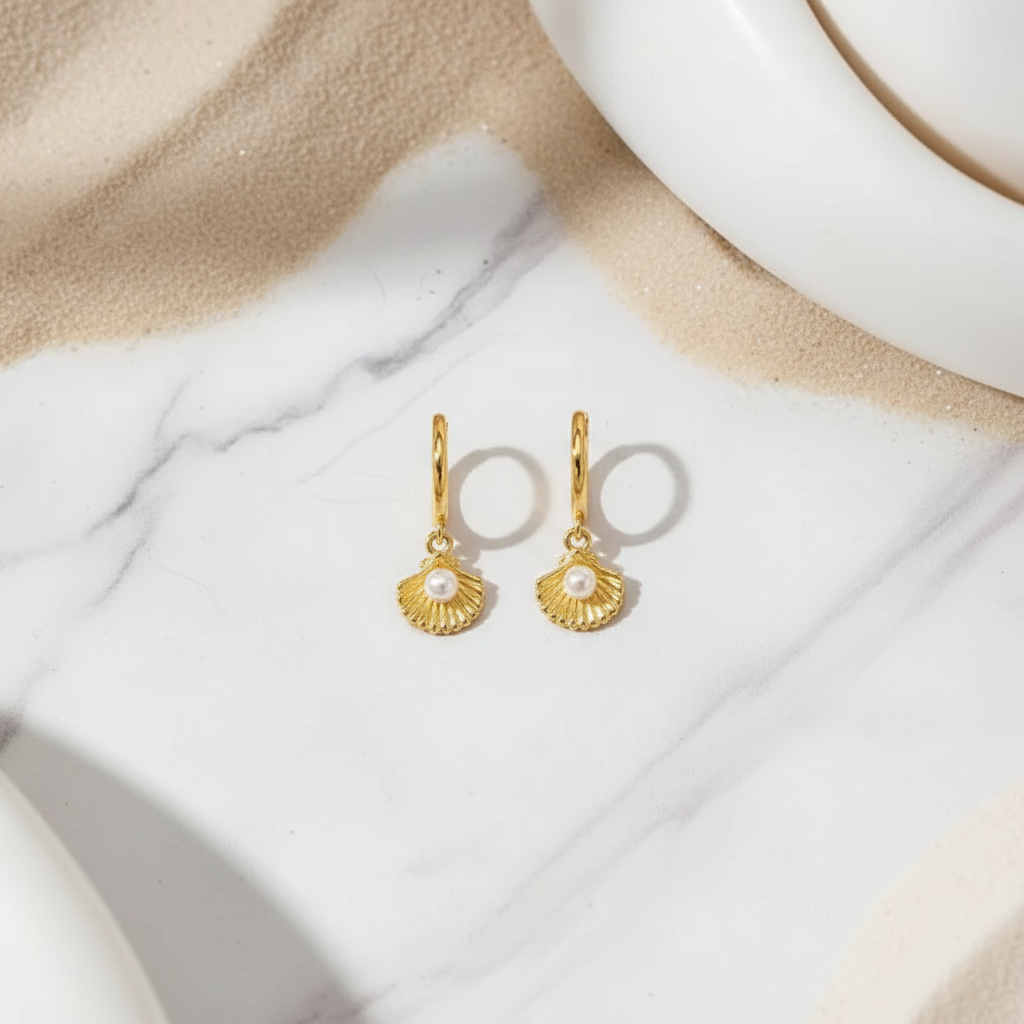 Gold coastal seashell hoops with shimmering pearl accent – beach-inspired earrings from Houseofhide Perth