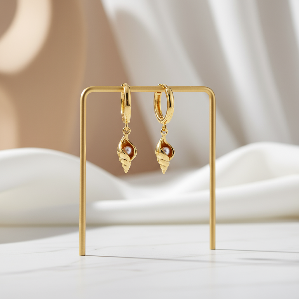 Gold coastal hoop earrings featuring intricate shell pendant and shimmering pearl accent – Houseofhide Australia