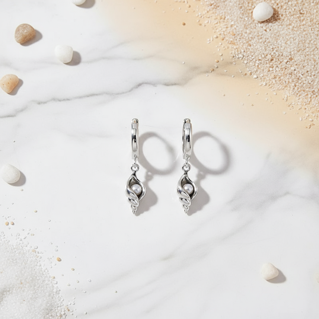 Silver coastal hoop earrings featuring shell and pearl charm – seaside-inspired design from Houseofhide