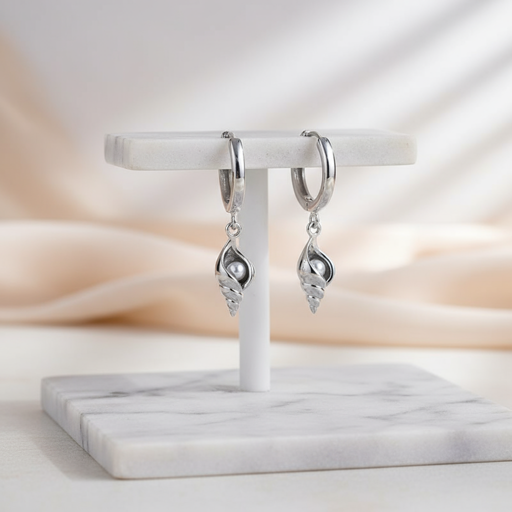 Polished silver shell hoop earrings with shimmering zircon – ocean-inspired accessory by Houseofhide Perth Australia