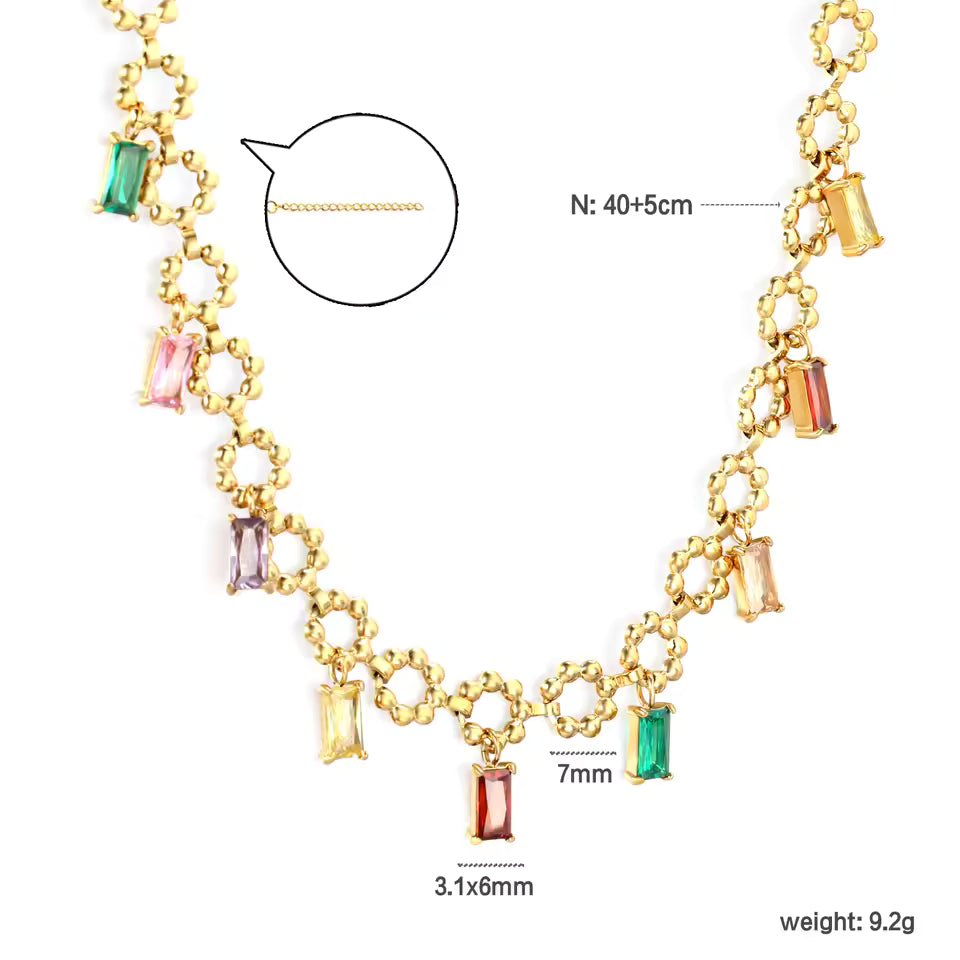 Gold necklace with colorful gemstones and measurements on a white background