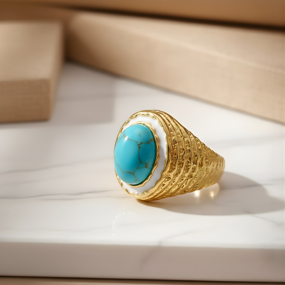 Coral Bay Ring featuring gold band with turquoise stone on white surface