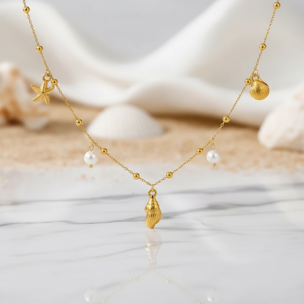House of Hide Coral Coast Charm Necklace Australian summer jewellery with gold shell starfish conch and pearl details