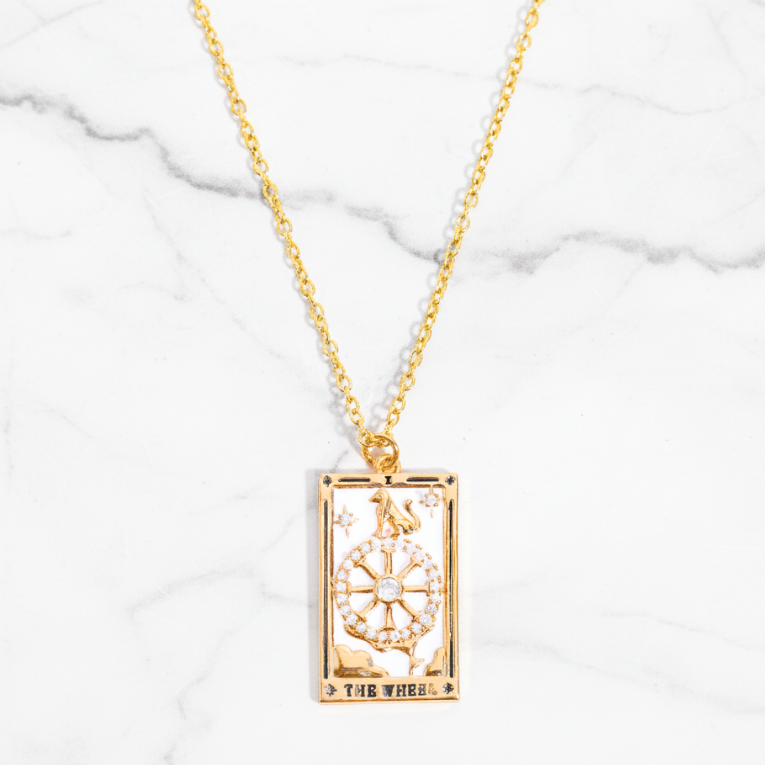 Divina Fortuna Necklace Perth Australia House of Hide gold necklace with rectangular pendant on marble background