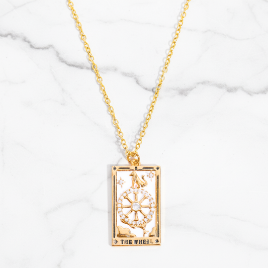 Divina Fortuna Necklace Perth Australia House of Hide gold necklace with rectangular pendant on marble background