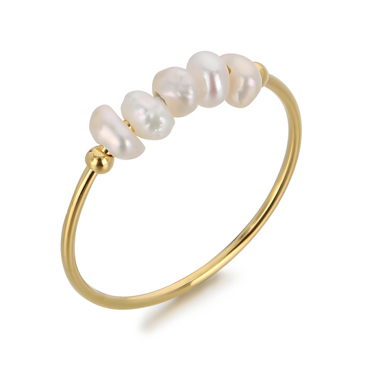 Golden freshwater pearl ring - close-up detailed view on a white background