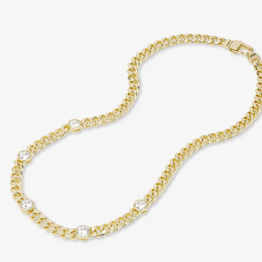 Golden necklace with diamond design on a white background