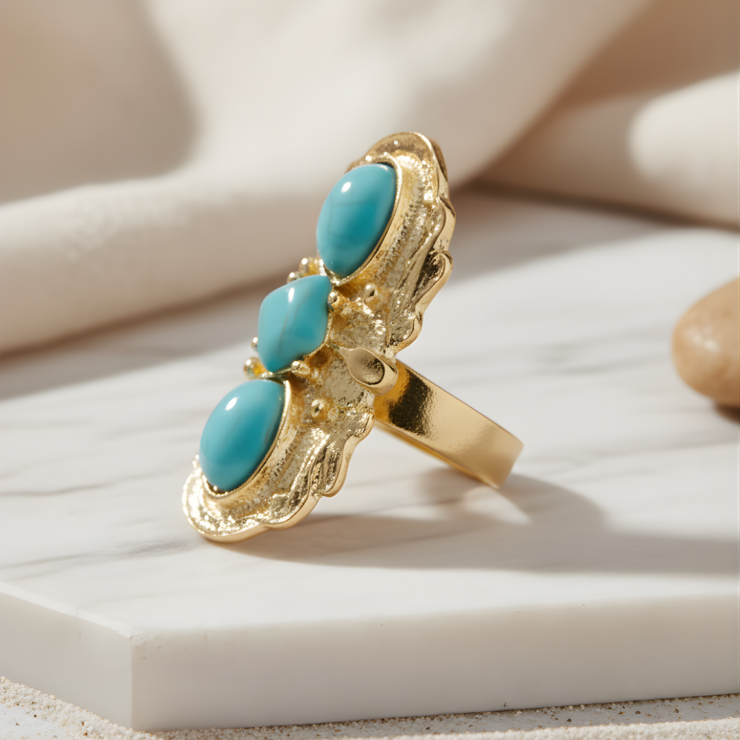 Isle of Tides Ring featuring gold band with three turquoise gems on light background