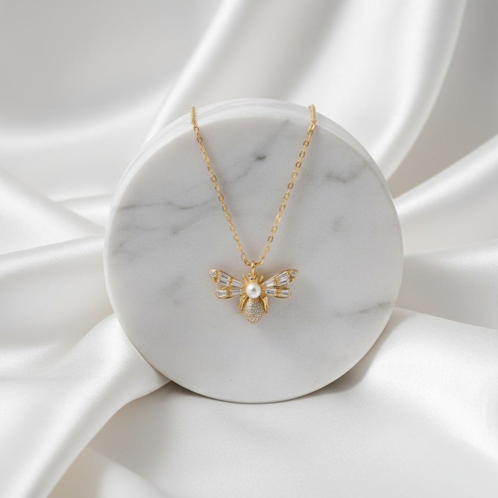 Gold-plated Luna Bee Necklace symbolising beauty, grace, and confidence with radiant crystal embellishments.
