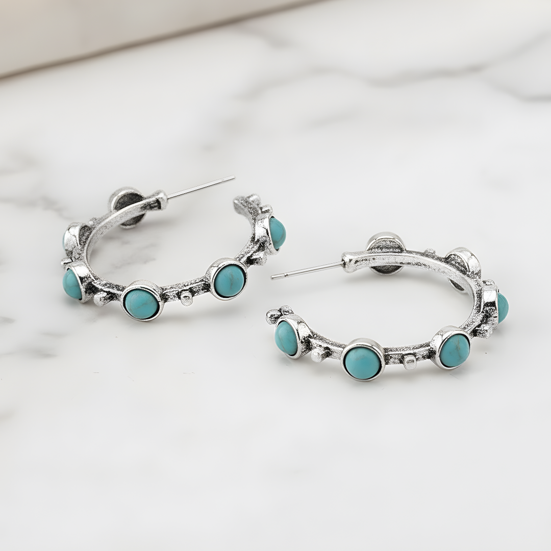 Silver hoop earrings featuring turquoise stones by House of Hide Perth jewellery