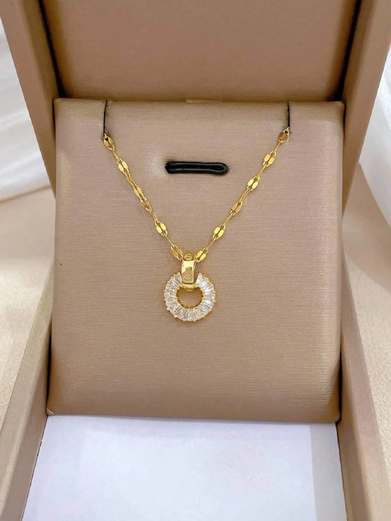 Dainty gold circle necklace in jewelry box, minimalist eternity ring pendant, baguette CZ delicate jewelry.