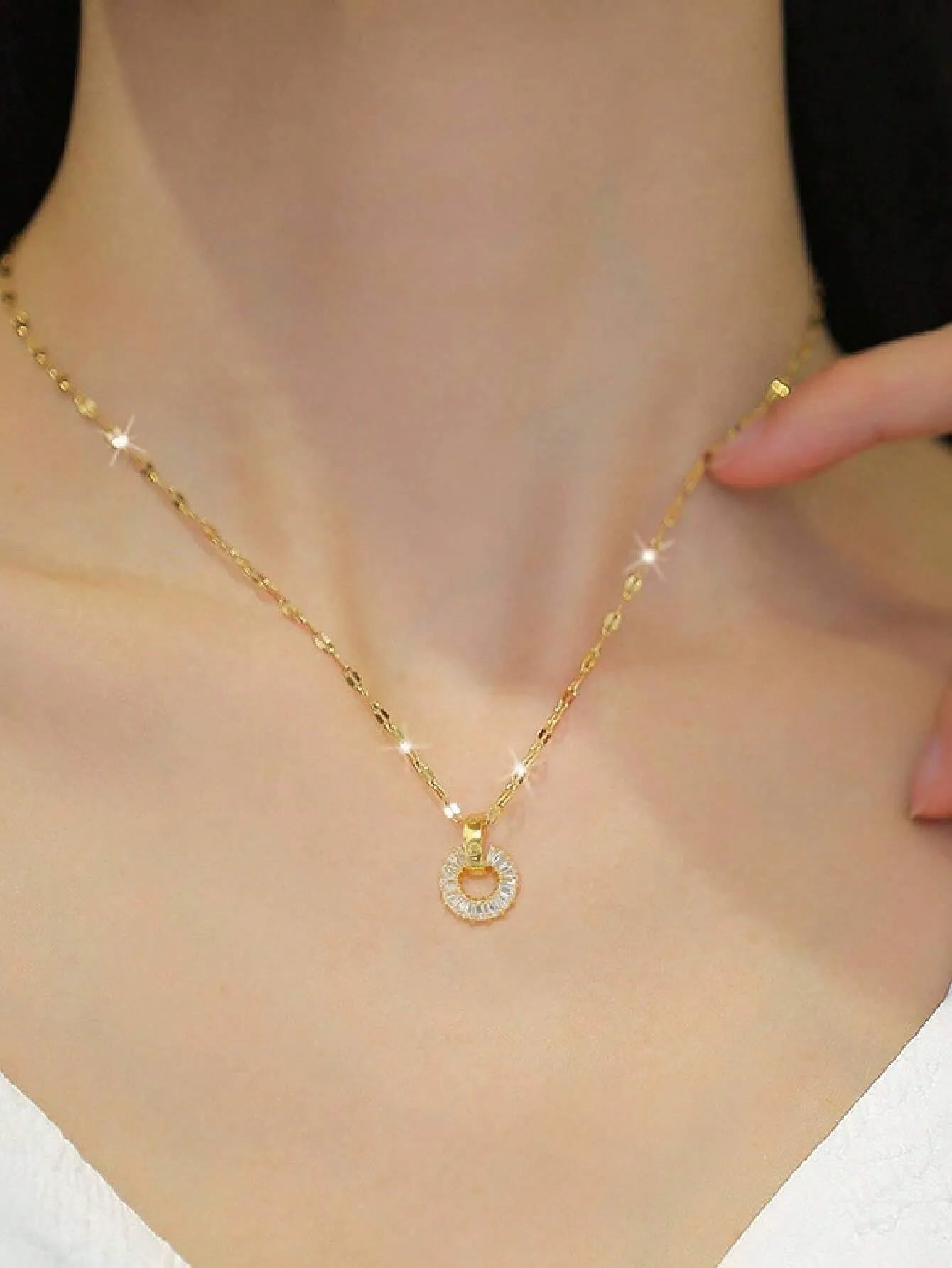 Dainty gold circle necklace worn, minimalist eternity ring pendant, baguette CZ delicate jewelry.