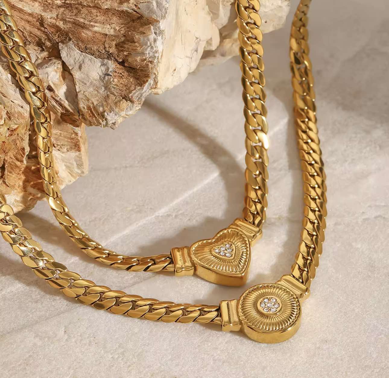 Flat lay of ribbed gold pendant necklaces styled for country-boho look”