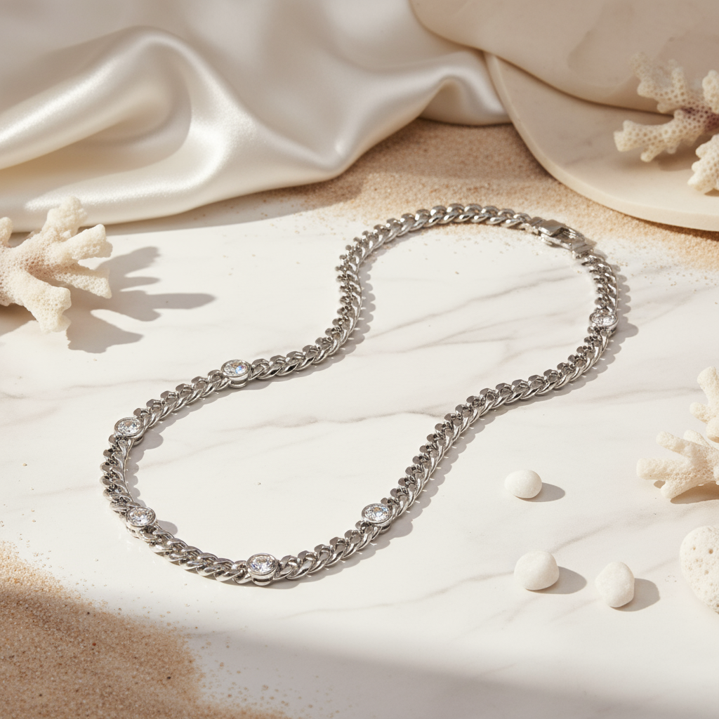 Elegant silver Cuban link necklace featuring five zircon stones and coastal-inspired shine by House of Hide Perth.