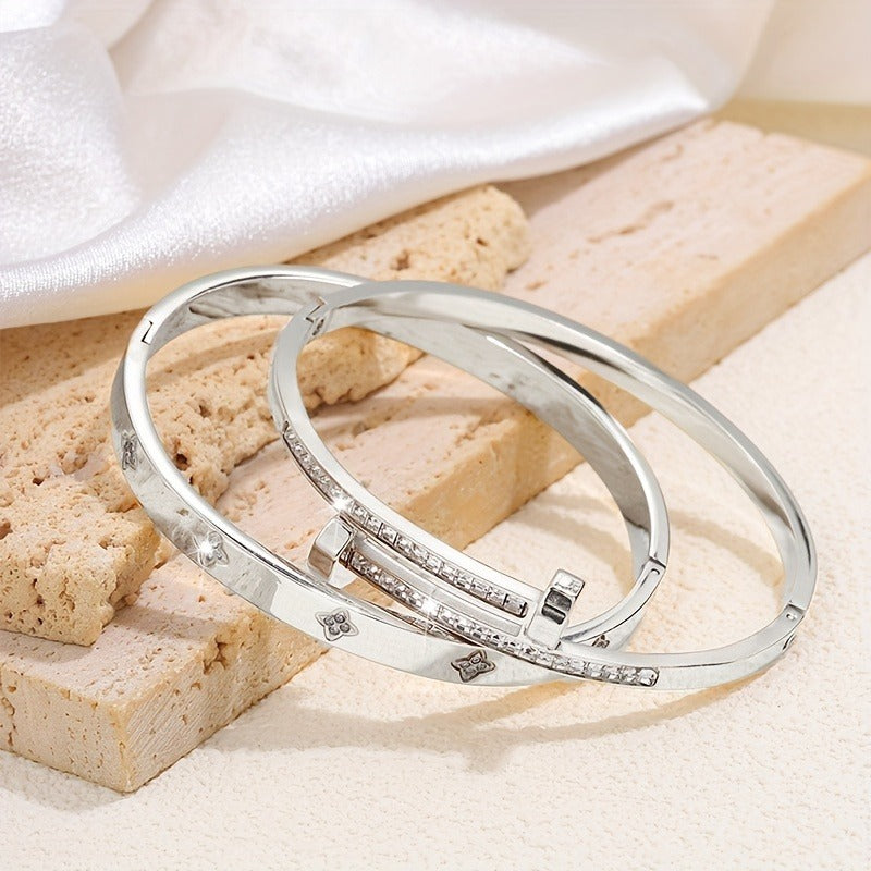 Silver stainless steel bracelet – close-up view laying on wood