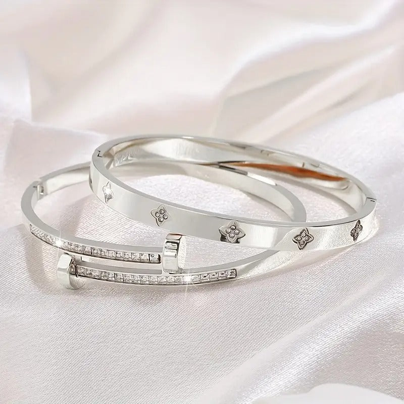 Silver stainless steel bracelet – flat lay angle on white satin background