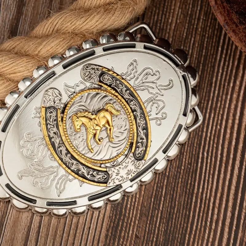 Silver stallion belt buckle on a wooden surface