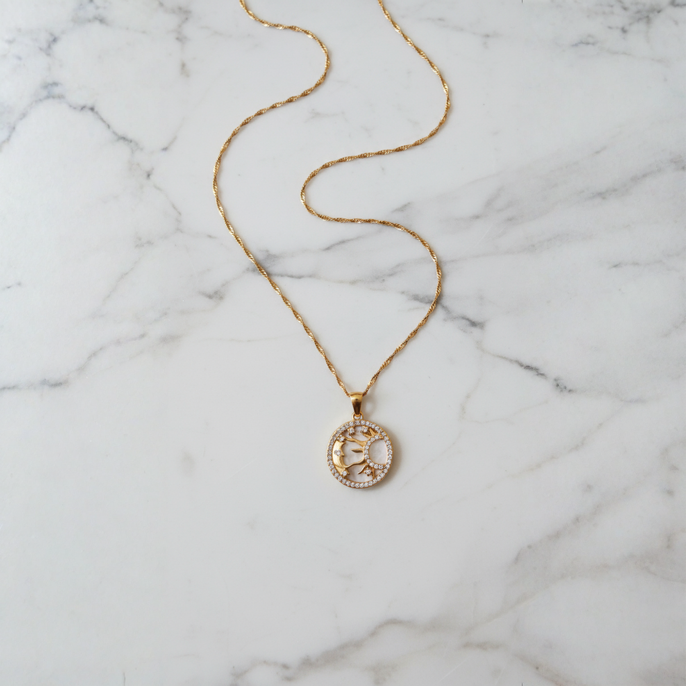 Solar Siren Necklace Perth Australia House of Hide gold celestial charm necklace with sun, moon, and star details
