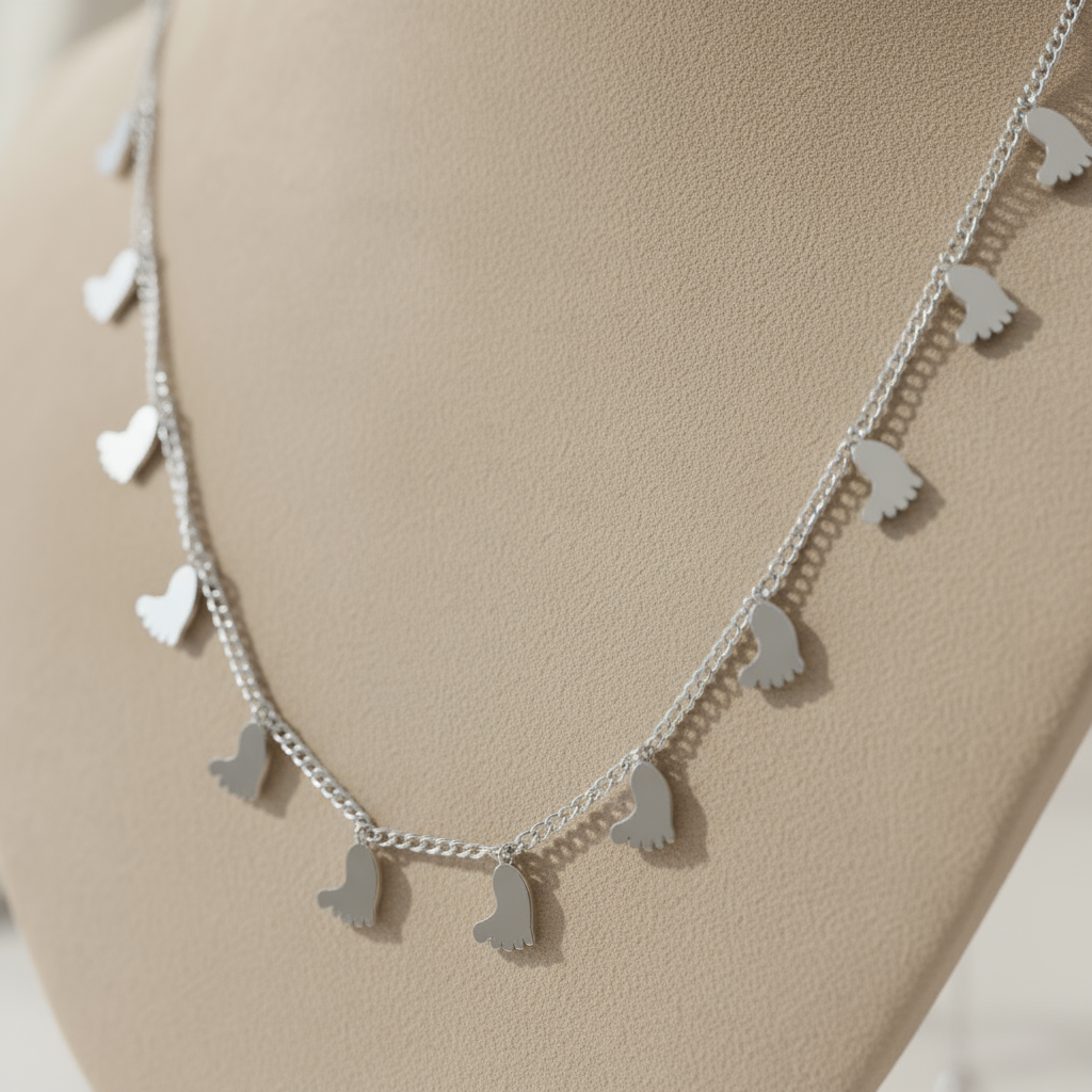 Summer Steps Charm Necklace Perth Australia House of Hide silver necklace with baby foot charms symbolising love and growth