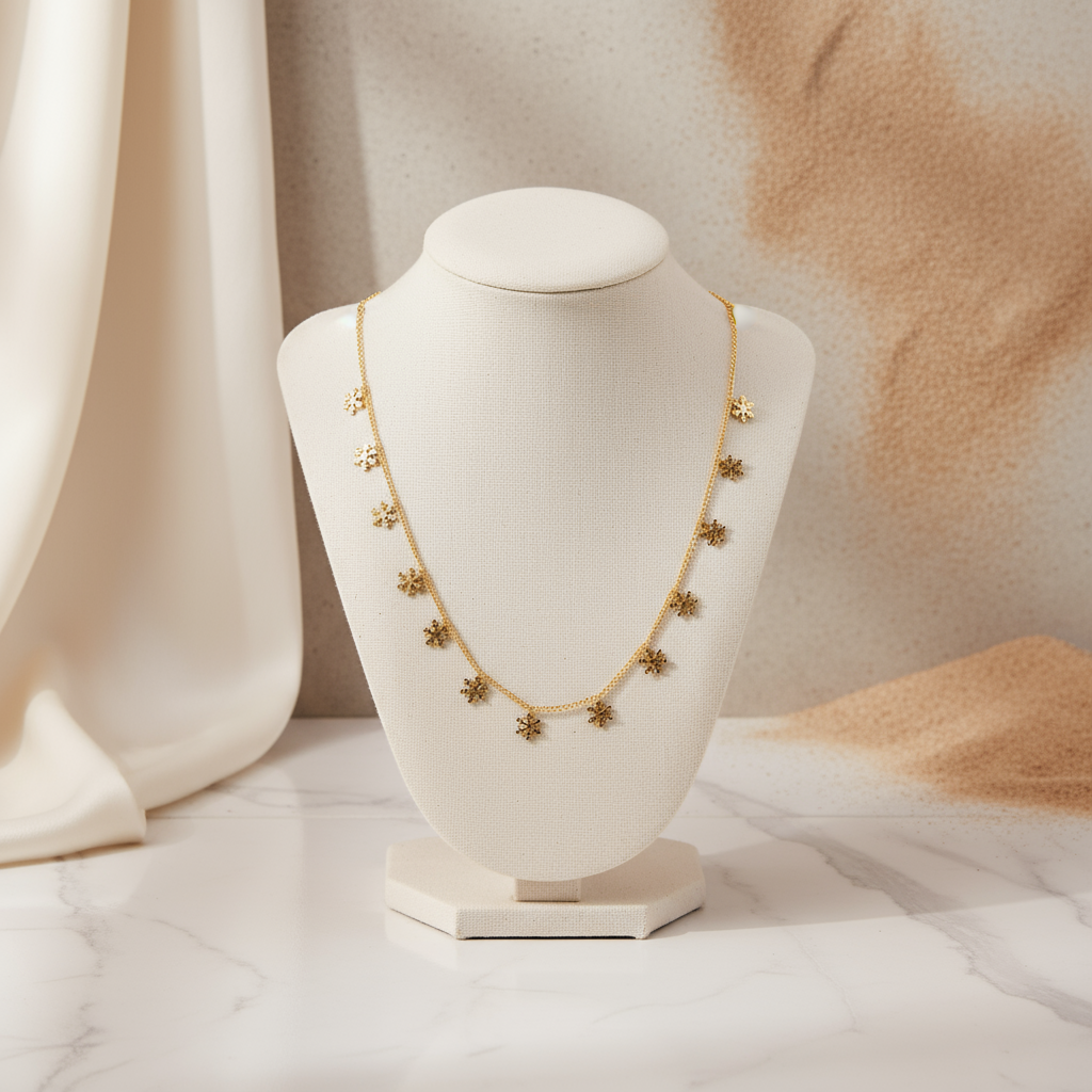House of Hide Sunlit Snowfall Necklace Perth gold accessory on light textured background with grass details