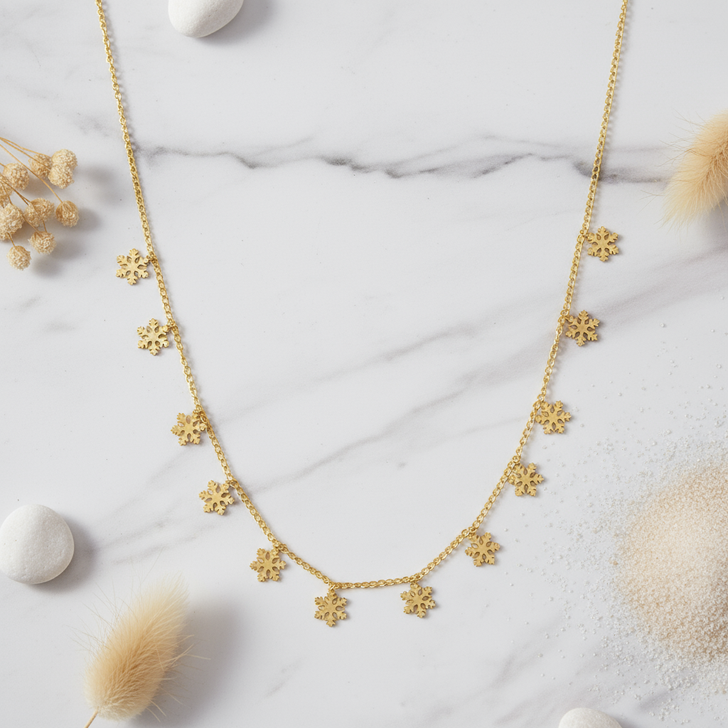 Gold necklace with gemstone details on a bright surface Perth Australia House of Hide Sunlit Snowfall design