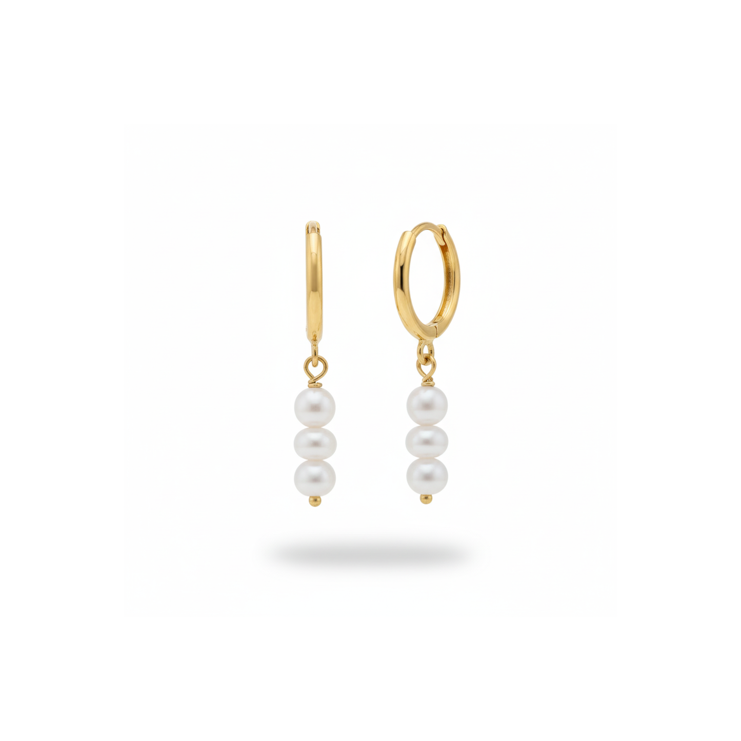 Sunseeker Drift Pearl Hoops Perth Australia House of Hide gold hoop earrings with pearl drops on beige fabric background