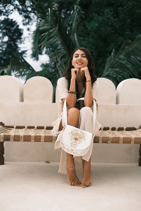 thically made leather crossbody with hand‑carved shell motif

Western Australia coastal inspired leather handbag with fringe
